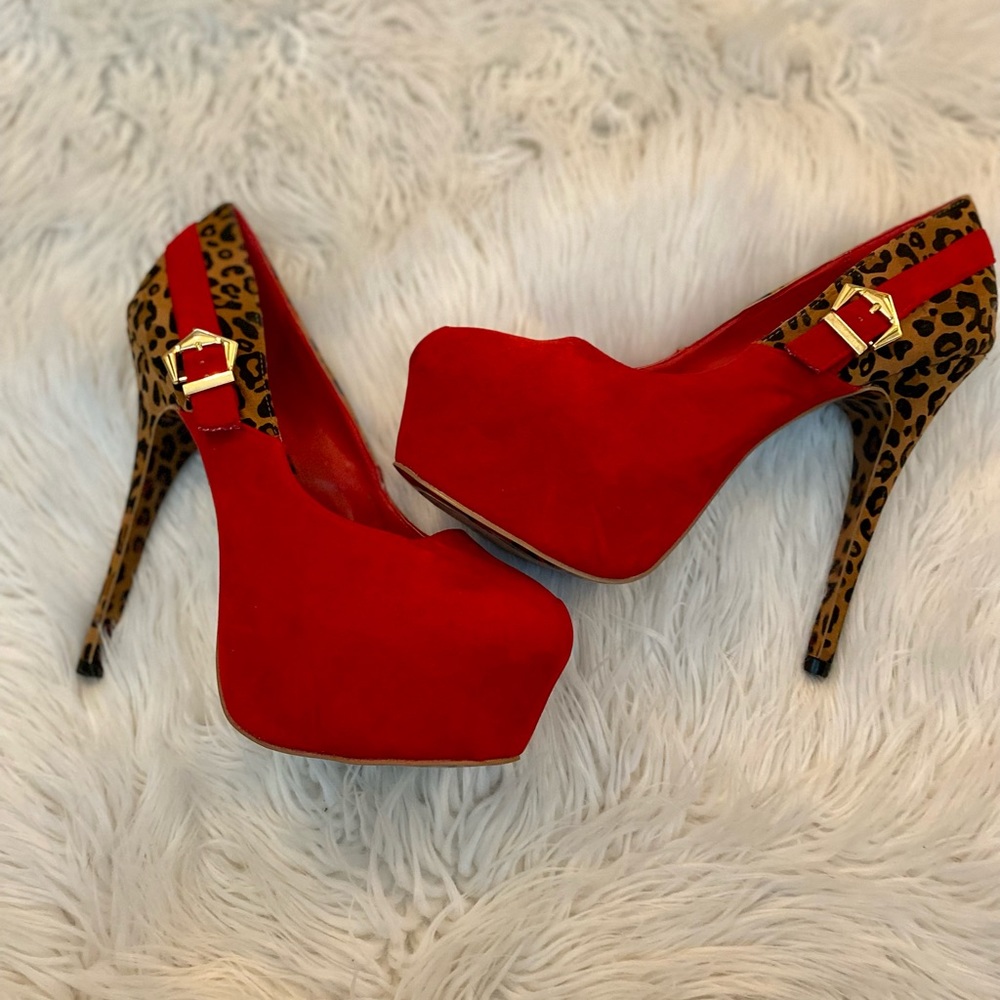 Brand new, never worn red leopard stiletto heels with side buckle.